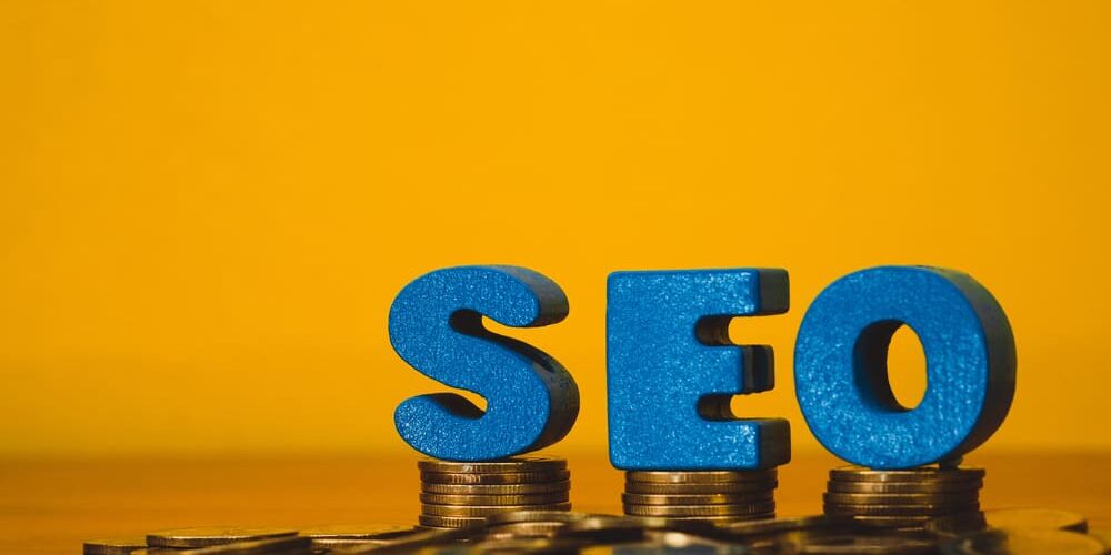 SEO money concept - image of stacked dollar bills with SEO text, representing making money with SEO marketing strategies.